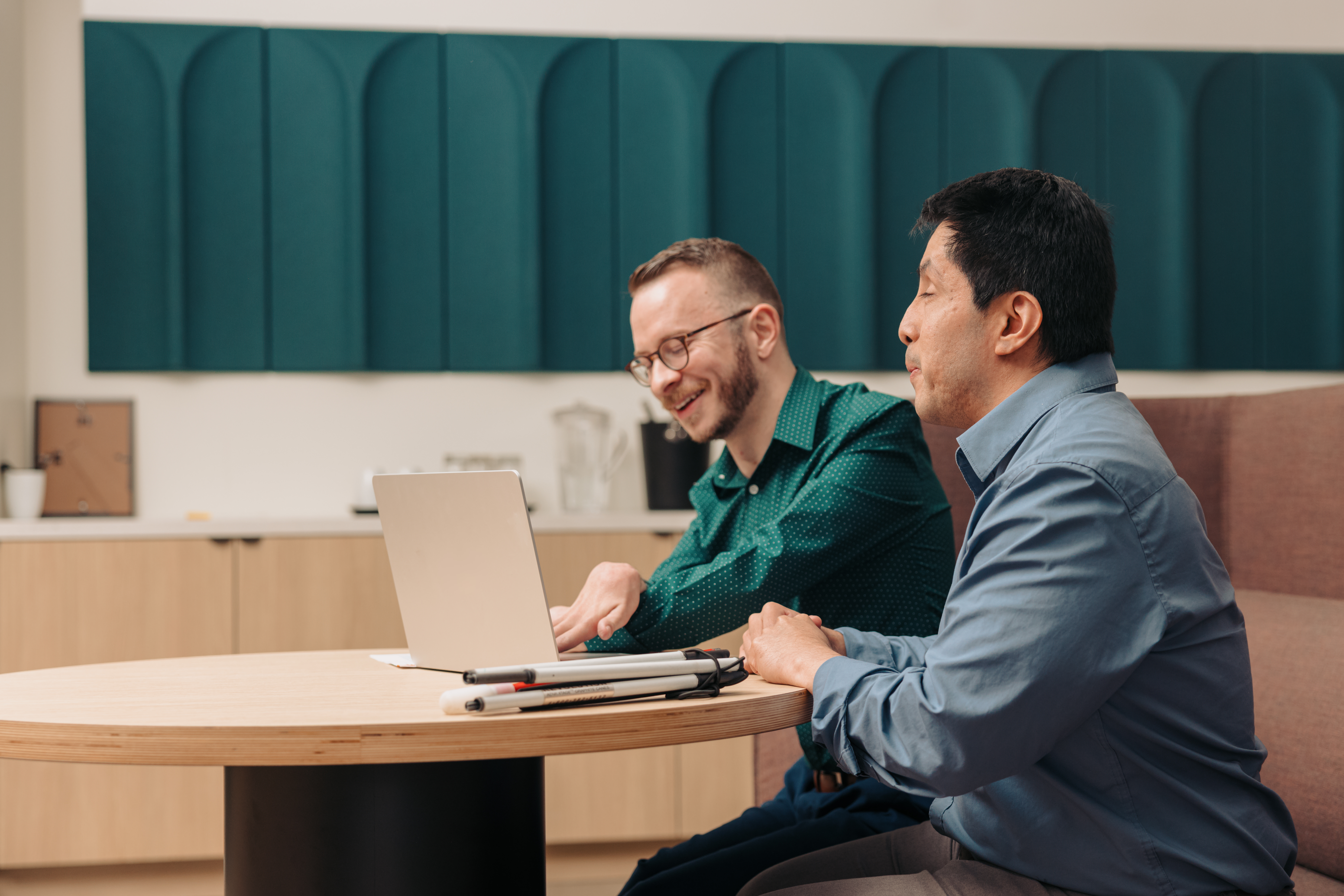 Colleagues collaborating, showing the human impact of your donations